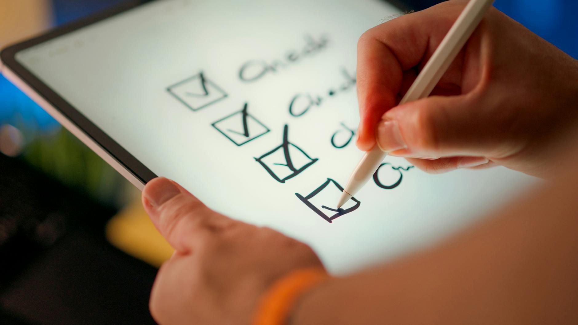 digital checklist on tablet with stylus